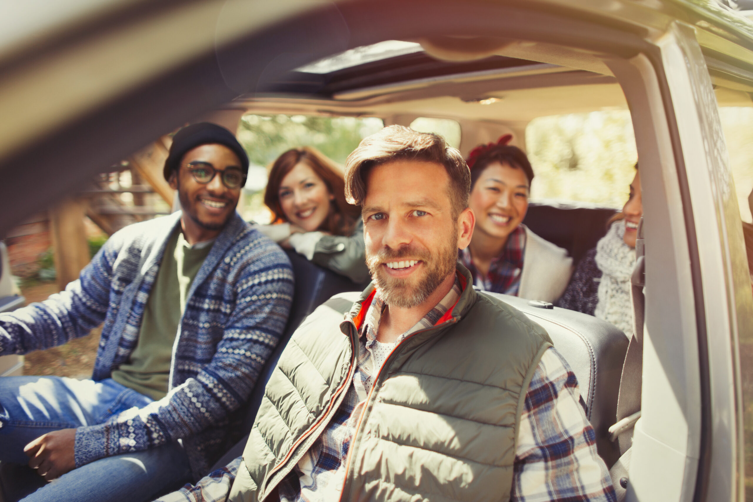 Portrait smiling friends inside car